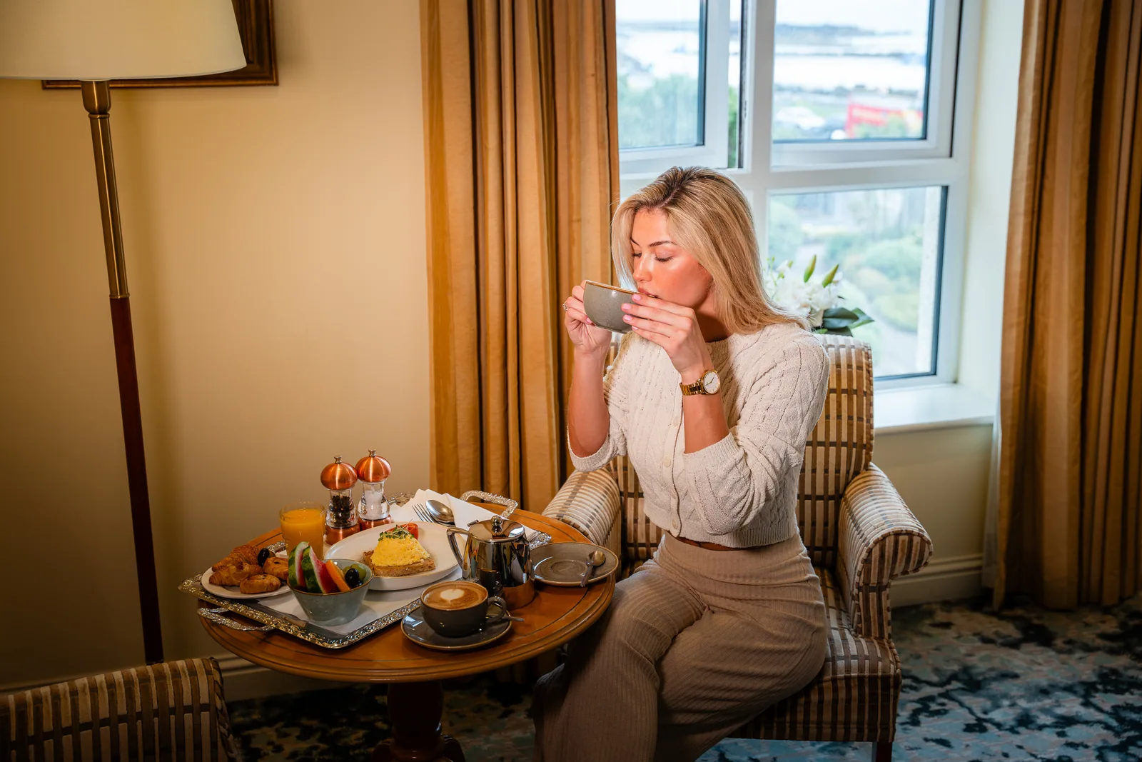 Galway Bay Hotel guest enjoying breakfast and bay view — hospitality photography by TN Media
